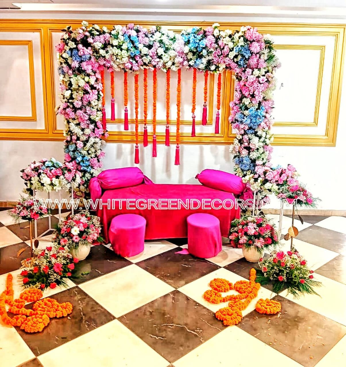 Pastel Pink Mehndi Lounge Setup With Artificial Flowers