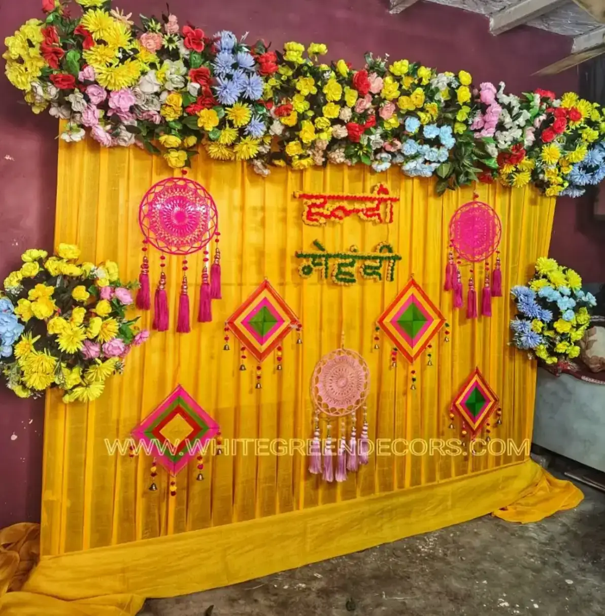 Simple Yellow Mehndi Backdrop Decoration with Floral Top