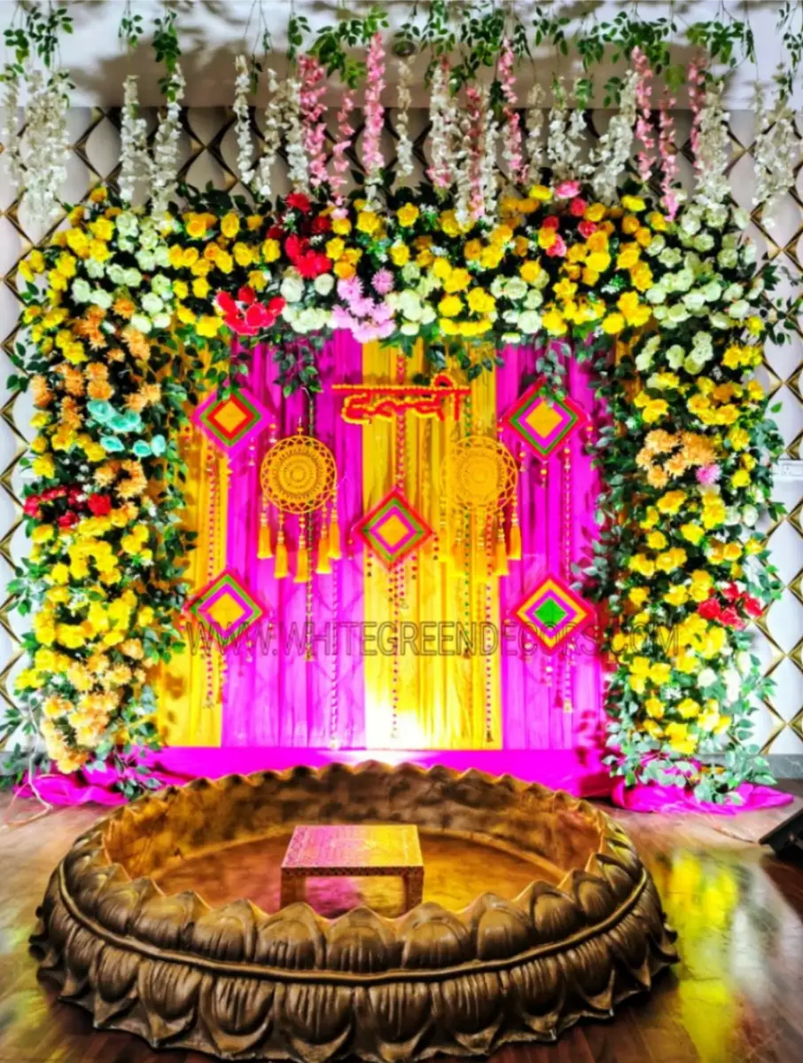 Luxury Haldi Urli Tub Setup with Floral Arch Backdrop